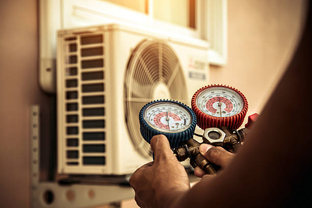 Professional Air Conditioning Service technician working in Lawrence, KS